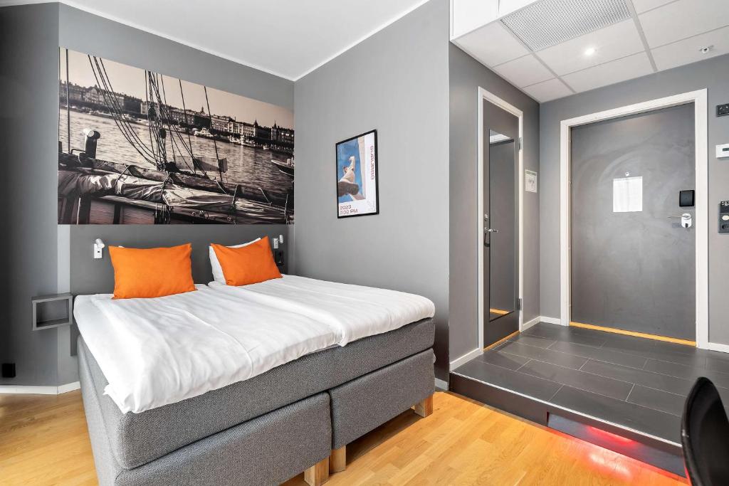 A bed or beds in a room at Aiden by Best Western Stockholm Arlanda Airport