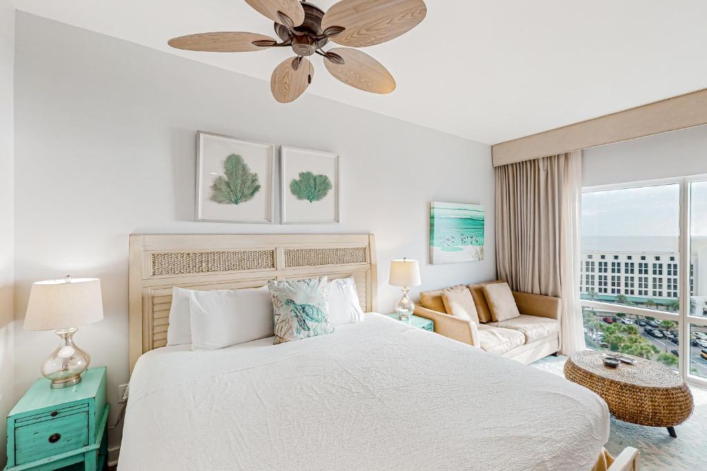 a bedroom with a bed and a ceiling fan at Luau 6834 in Destin