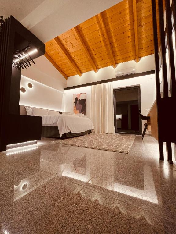a bedroom with a bed and a glass floor at Oiko Worth Living No7 in Ioannina