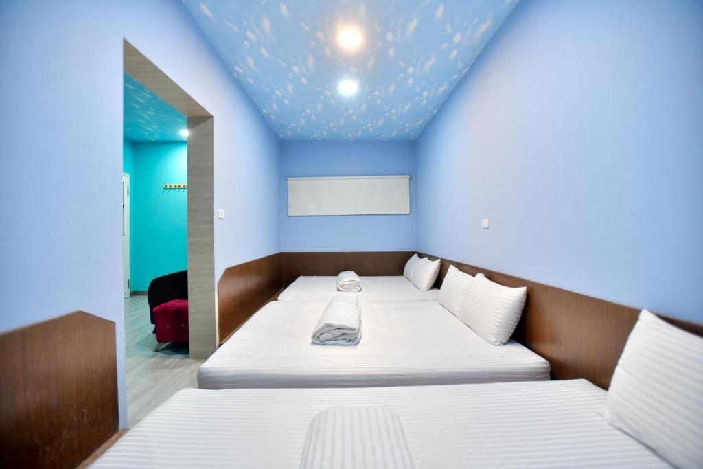 Postel nebo postele na pokoji v ubytování Ye Yuan Star Homestay