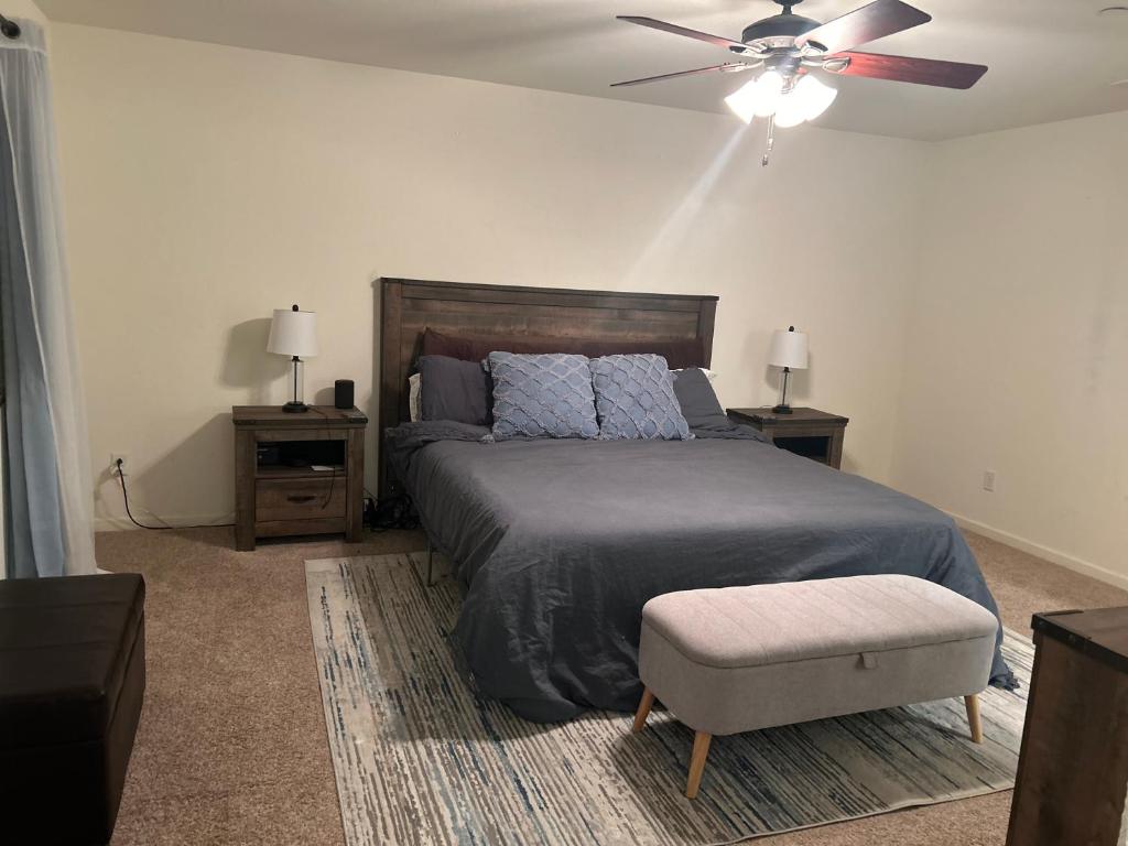 a bedroom with a bed and a ceiling fan at 3238 Correll Way in Rancho Cordova