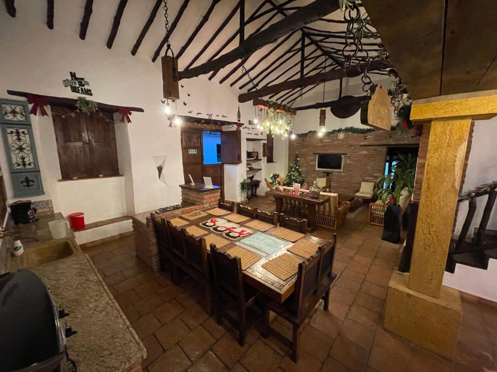 an overhead view of a large room with a table and chairs at Casa Real Barichara in Barichara