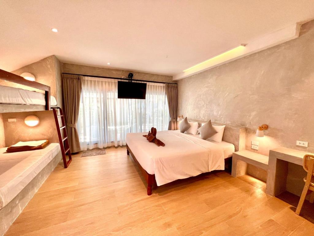 Ein Bett oder Betten in einem Zimmer der Unterkunft Twin Bay Resort Koh Lanta