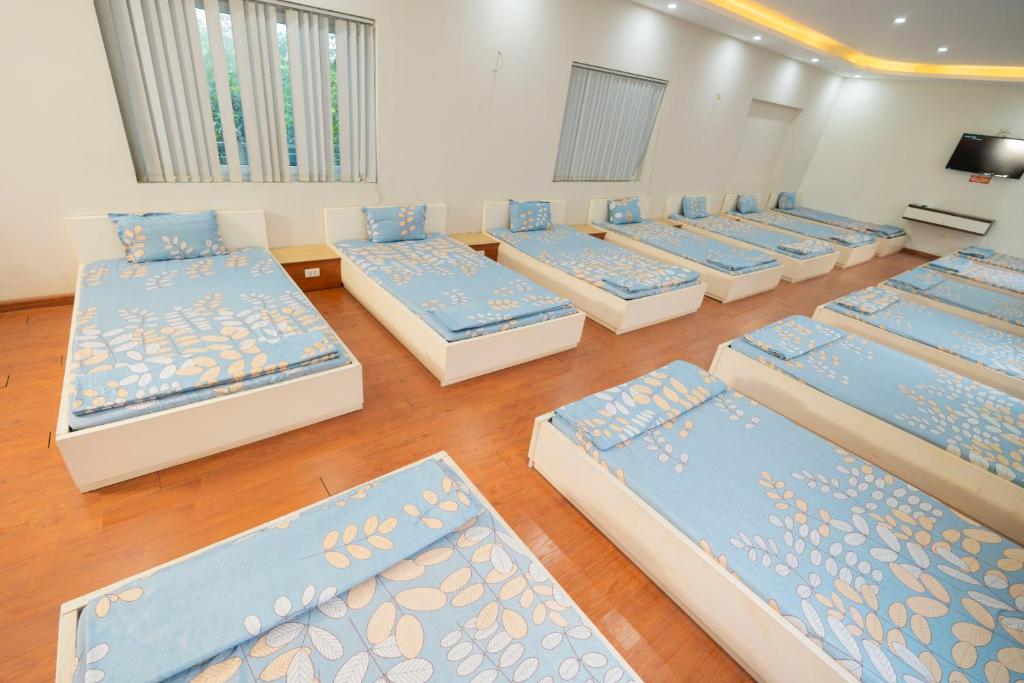 Postel nebo postele na pokoji v ubytování Biển Đông COMPLEX