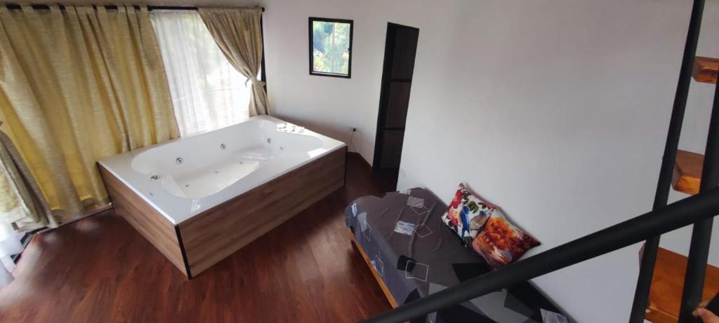 Postel nebo postele na pokoji v ubytování GLAMPING Aldea Muisca