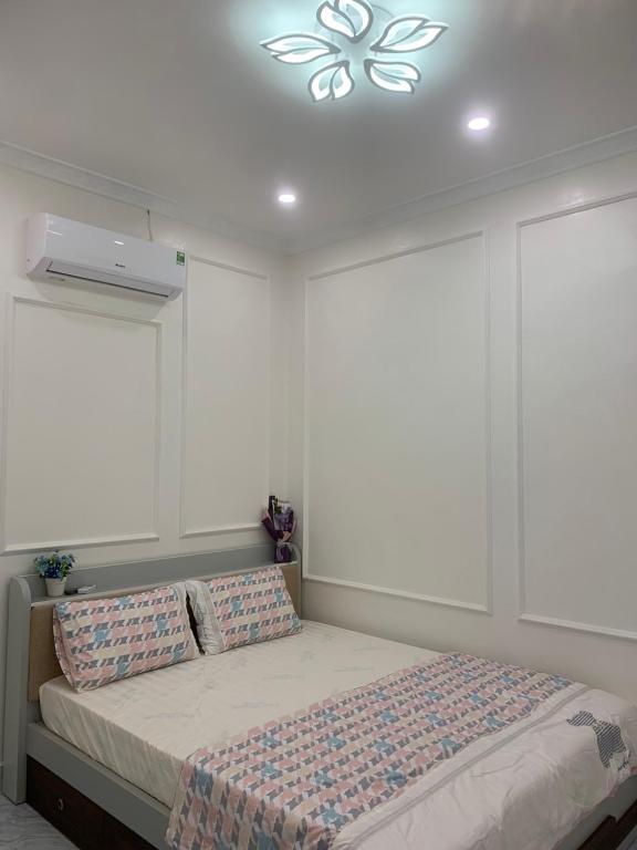 Postel nebo postele na pokoji v ubytování Rustic Homestay - Phòng nghỉ giá rẻ