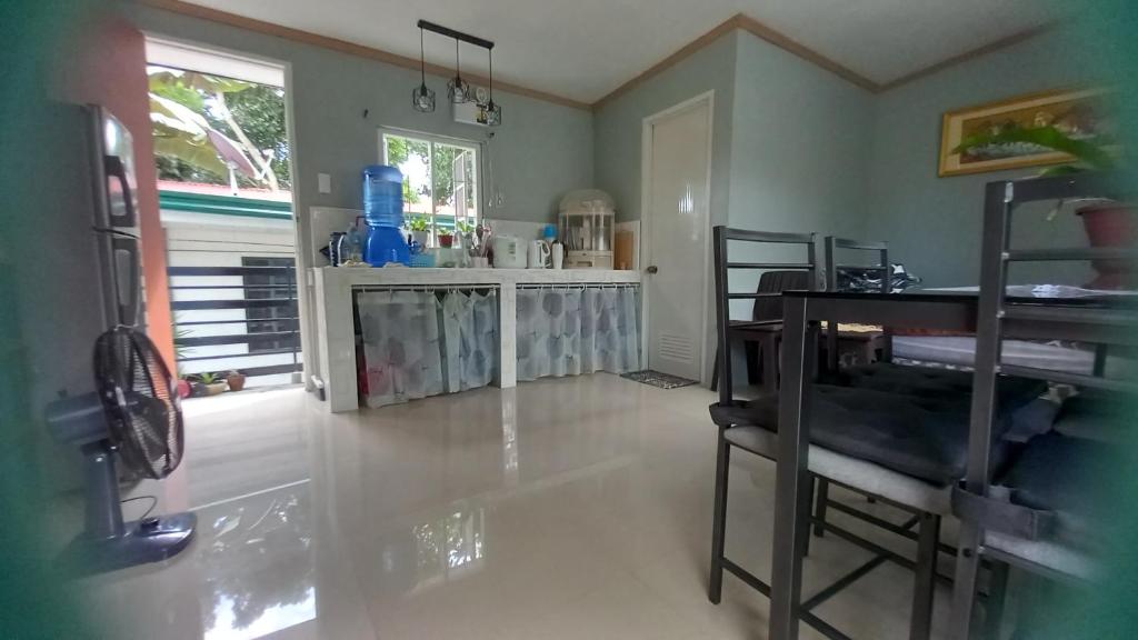 a kitchen with a table and a counter top at QuiapoSuites Bohol in Tagbilaran City