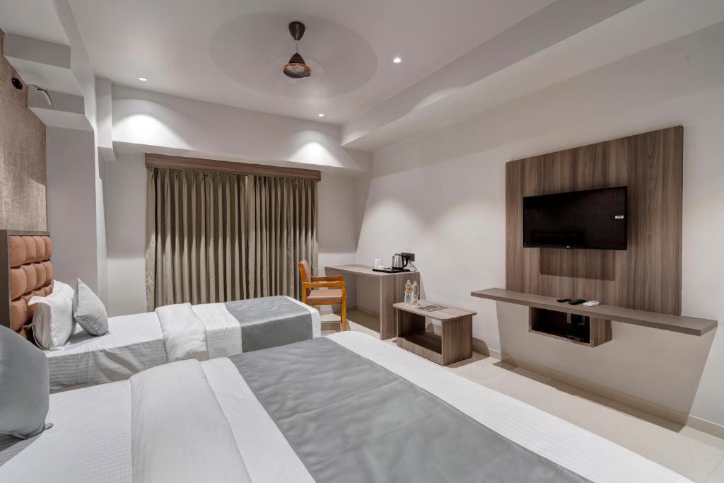 Postel nebo postele na pokoji v ubytování Hotel Sparsh Divine