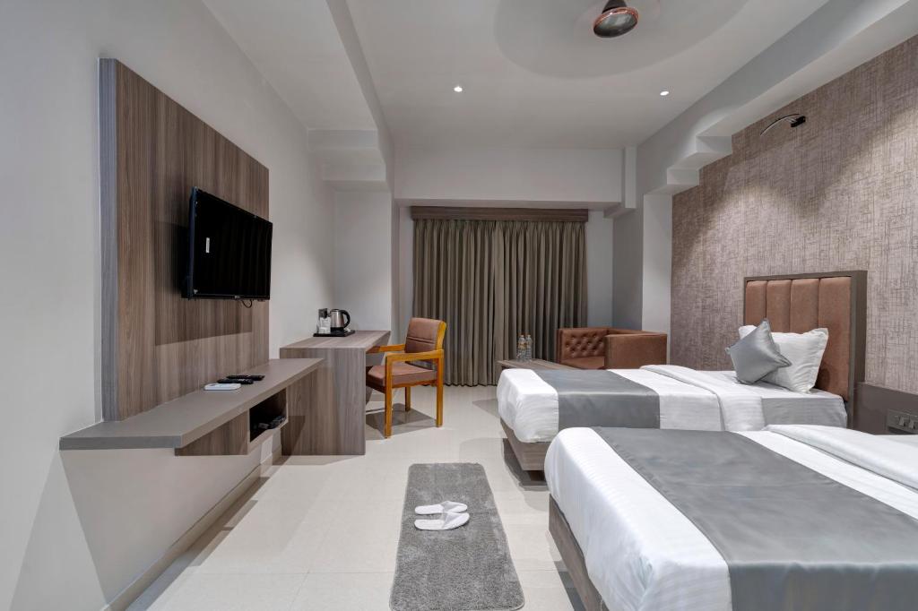 Postel nebo postele na pokoji v ubytování Hotel Sparsh Divine