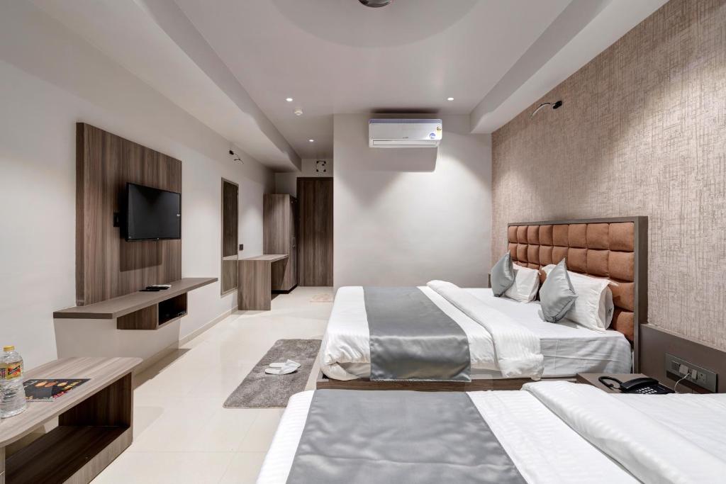 Postel nebo postele na pokoji v ubytování Hotel Sparsh Divine