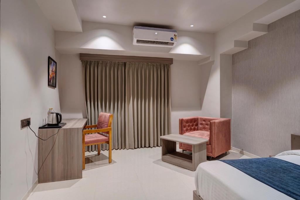 Postel nebo postele na pokoji v ubytování Hotel Sparsh Divine