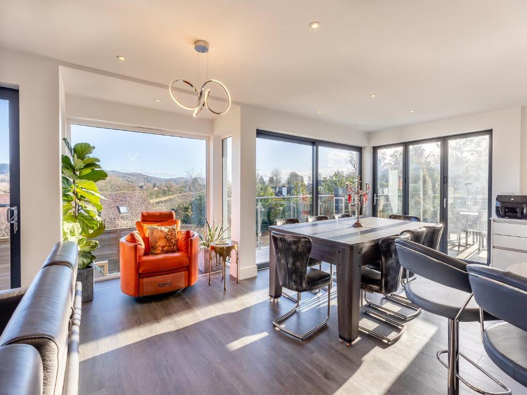 a dining room with a table and chairs at The Brook - Uk45836 in Mathon