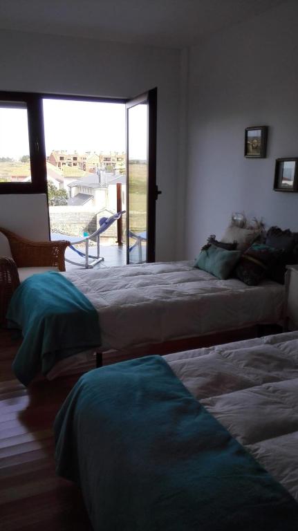 A bed or beds in a room at duplex de lujo en medio del paraiso