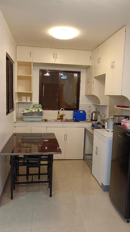 Kuchyň nebo kuchyňský kout v ubytování Masterpiece Staycation Makati