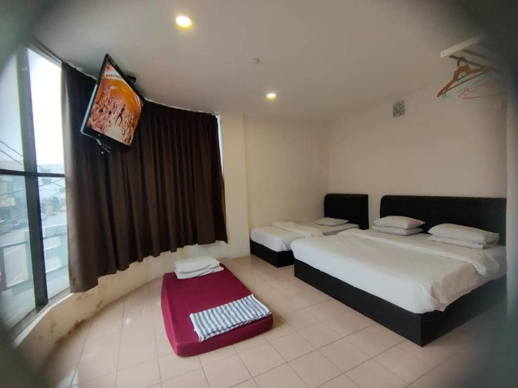 Postel nebo postele na pokoji v ubytování Anderson Hotel
