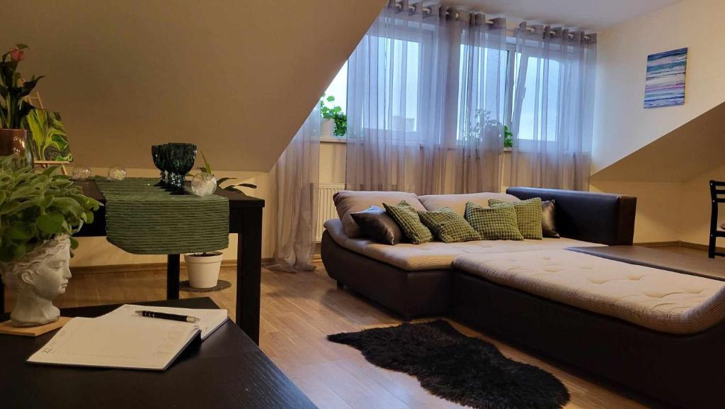 a living room with a couch and a table at Riga Centre Sun Apartments in Rīga