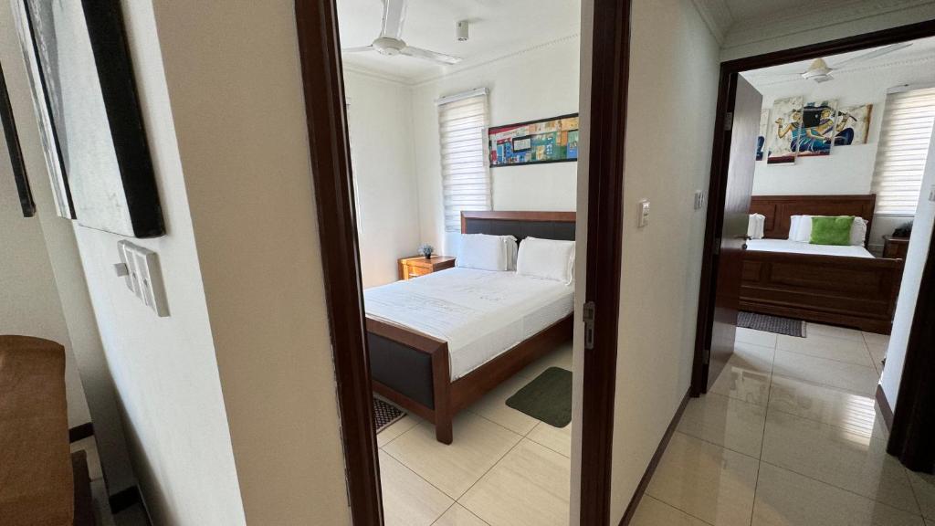 Postel nebo postele na pokoji v ubytování SkyLounge Apartment Colombo