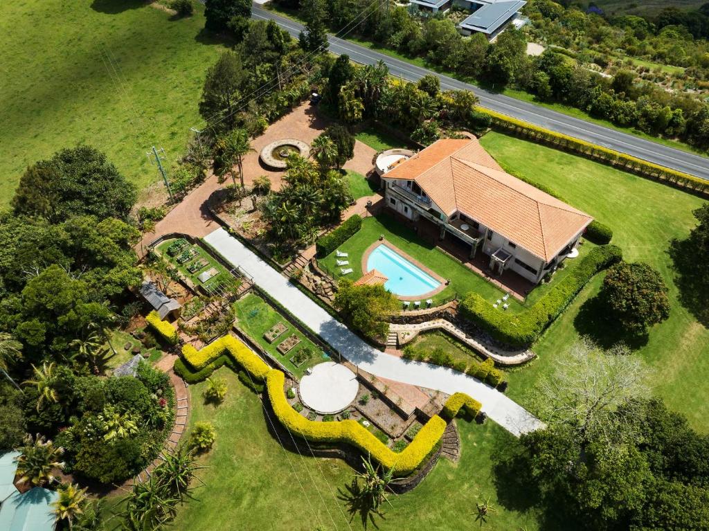 an aerial view of a house with a swimming pool at Riana in Coorabell Creek