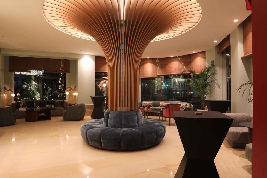 Posezení v ubytování Warwick Palm Beach Hotel