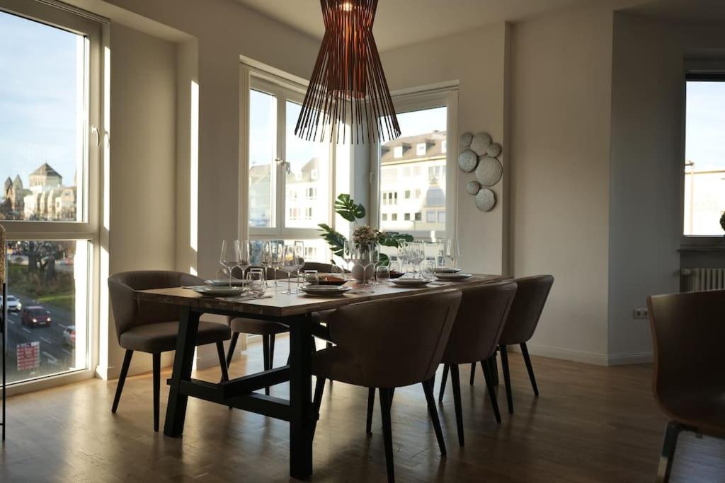 a dining room with a table and chairs at Urban retreat loft in the center in Koblenz
