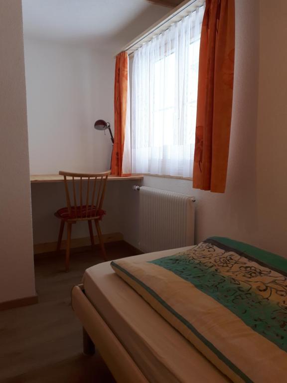 Postelja oz. postelje v sobi nastanitve Ferienwohnung Tschudiboden