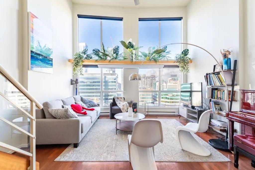 a living room with a couch and a table at loft in downtown Vancouver with free parking in Vancouver