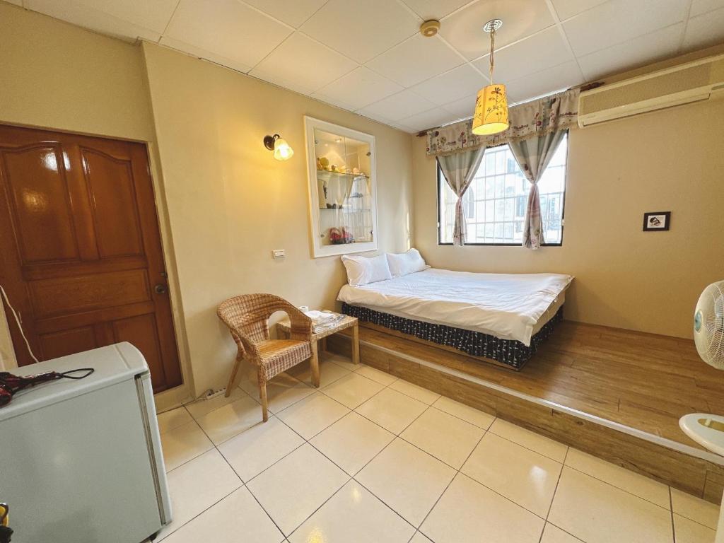 Postel nebo postele na pokoji v ubytování Zhixinyuan B&B