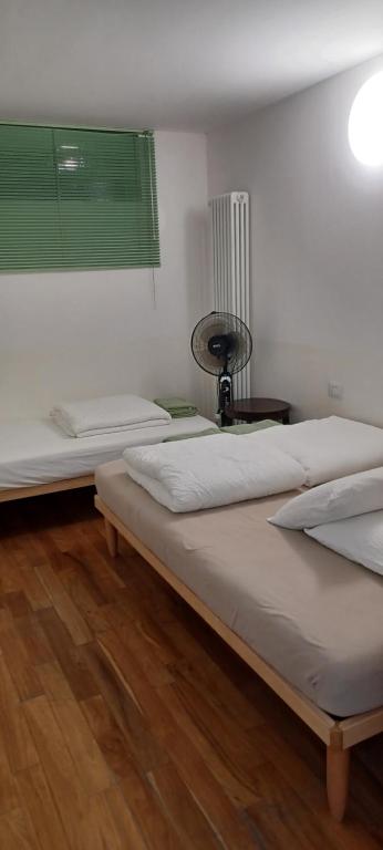 Postel nebo postele na pokoji v ubytování Como 3 B&B