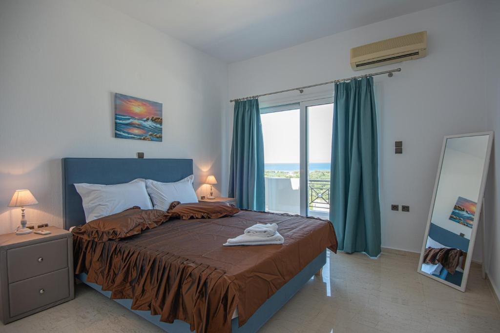 A bed or beds in a room at Istron MiraBella Villas