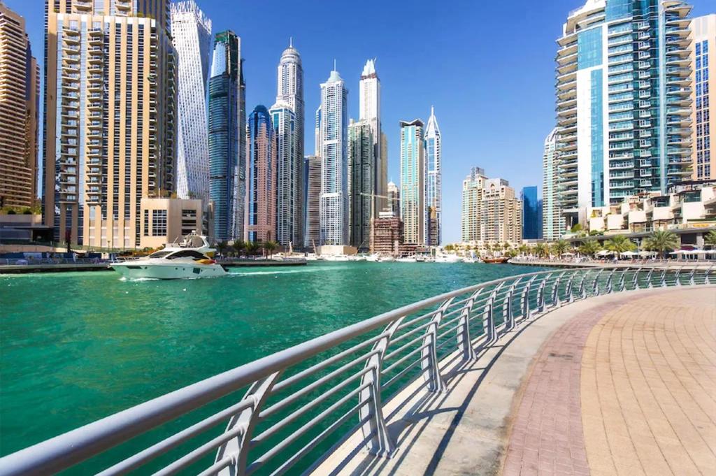 a river in front of a city with tall buildings at Budget 1BR Apt in Marina - Near Tram & Metro -Time in Dubai