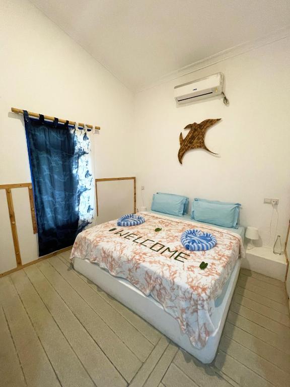 Postel nebo postele na pokoji v ubytování La Due Thulusdhoo