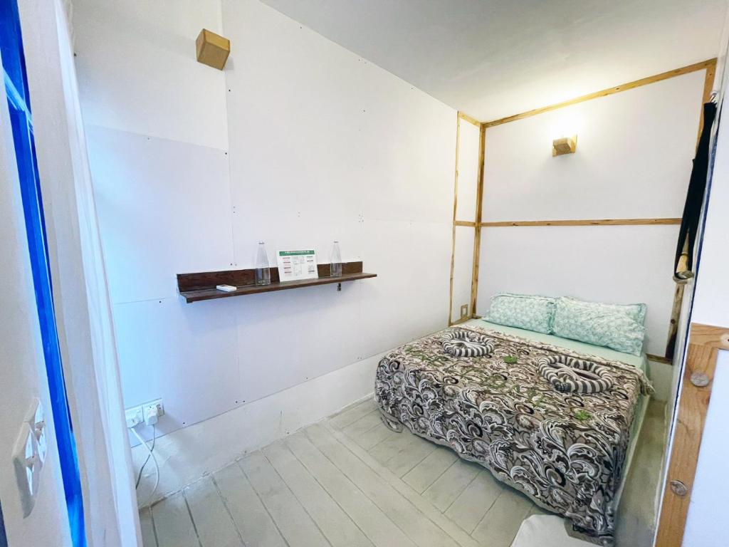 Postel nebo postele na pokoji v ubytování La Due Thulusdhoo