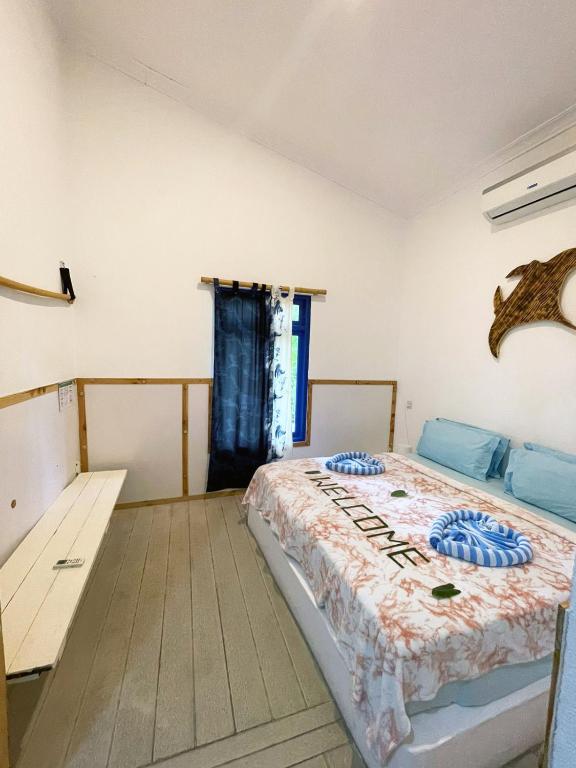 Postel nebo postele na pokoji v ubytování La Due Thulusdhoo