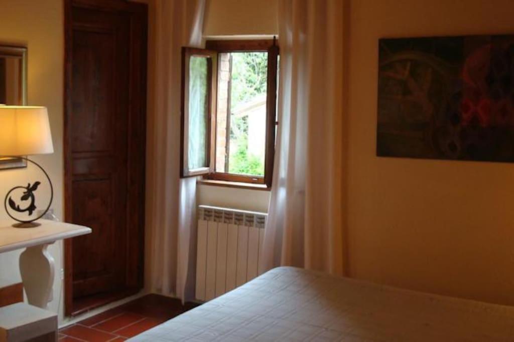 Łóżko lub łóżka w pokoju w obiekcie B&B Countryhouse Villa Baciolo