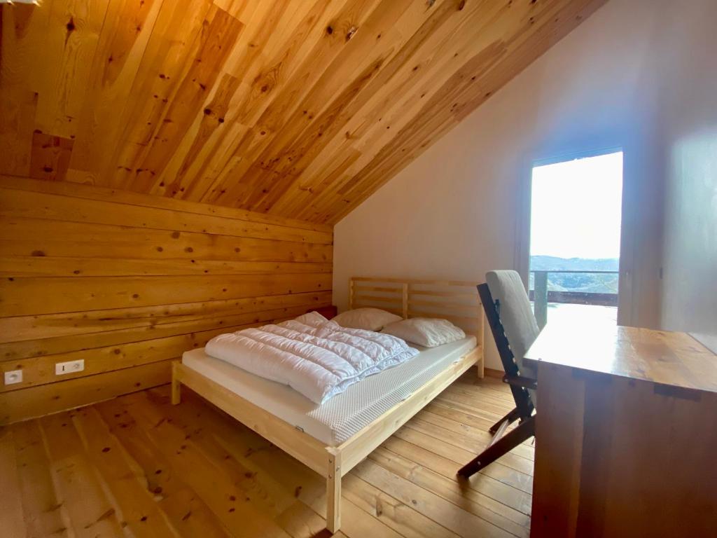 Postel nebo postele na pokoji v ubytování Chalet vue lac