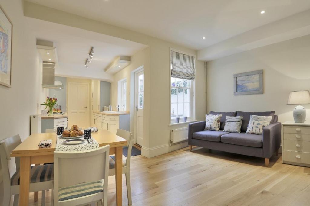 a living room with a couch and a table at 33 Victoria Street in Southwold