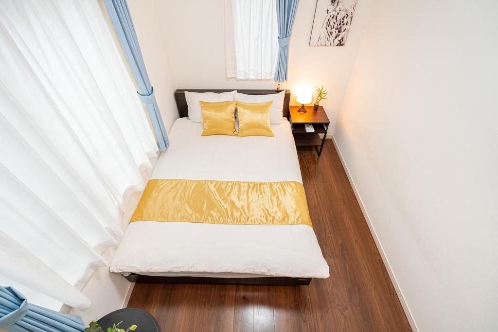 Postel nebo postele na pokoji v ubytování KYARA Hotel 浅草