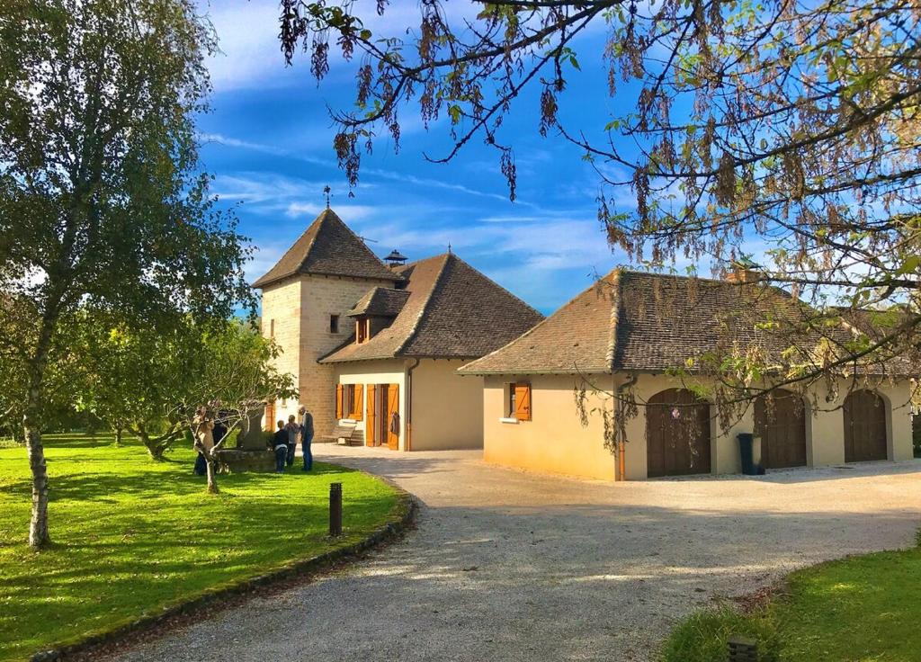 a large white building with a grass yard at Domaine De Dadelsen - Beautiful Country Estate in Loisy