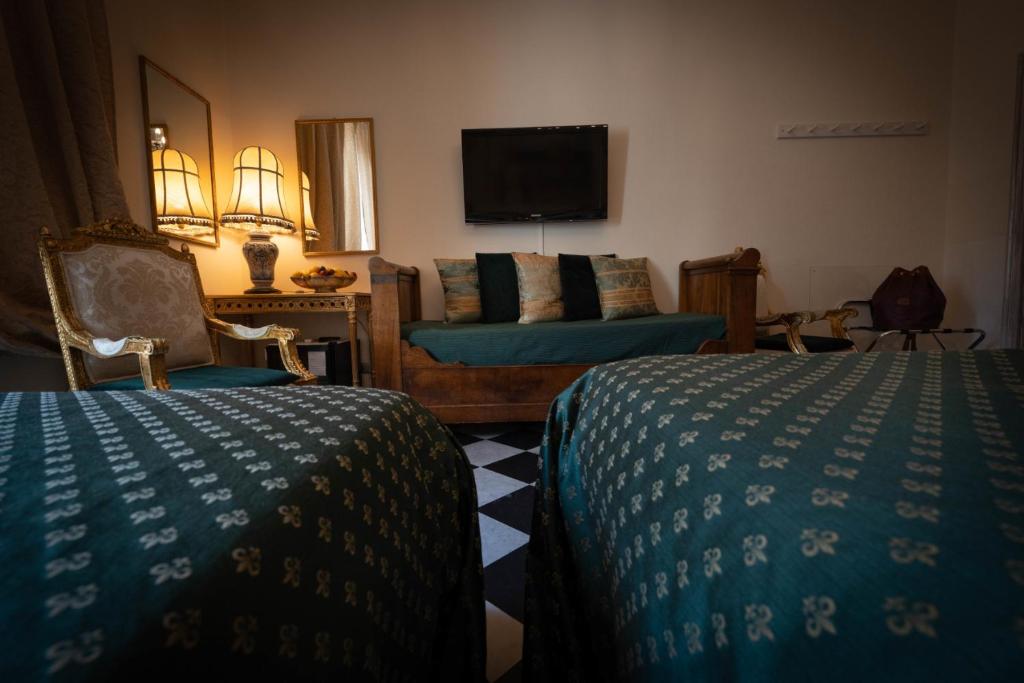 Postel nebo postele na pokoji v ubytování Morali Palace