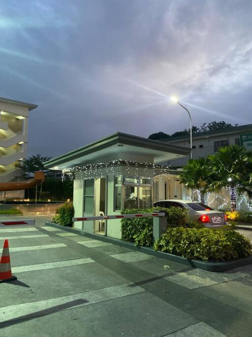 a house with christmas lights in a parking lot at Condotel Minimalist in Marilao