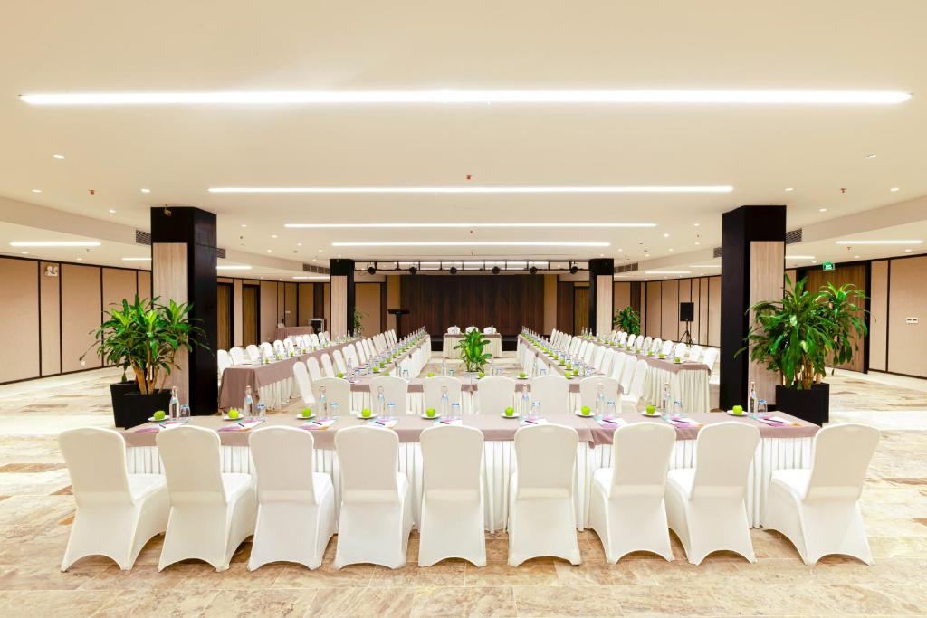 A large ballroom-style conference room set for a formal banquet.