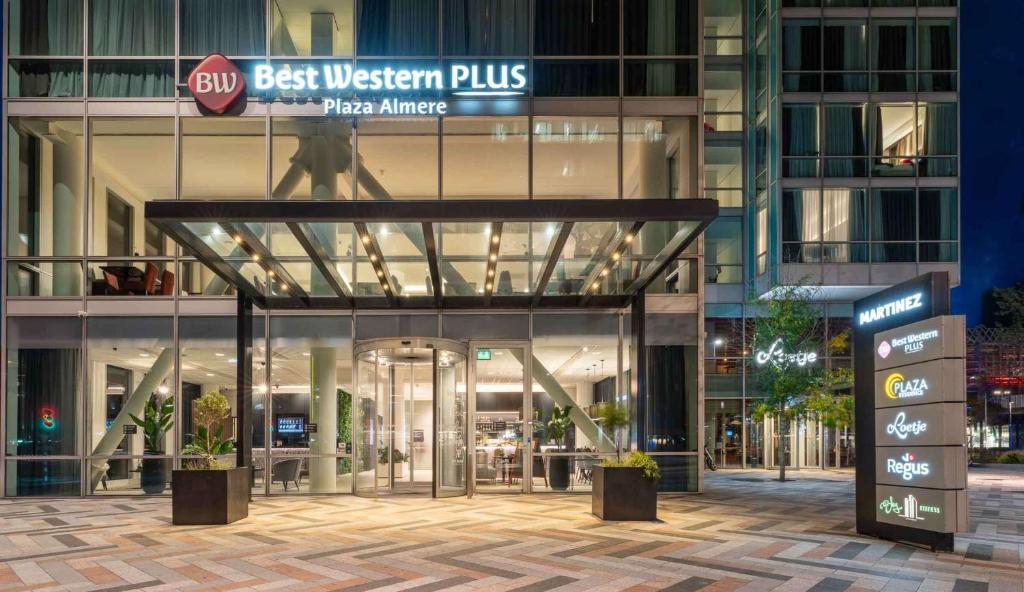 a building with a sign that reads best western plus at Best Western Plus Plaza Almere in Almere