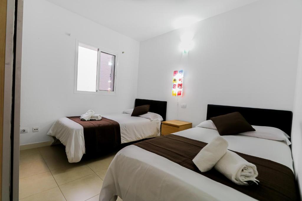 Posteľ alebo postele v izbe v ubytovaní Cheerful house Puerto de las Nieves