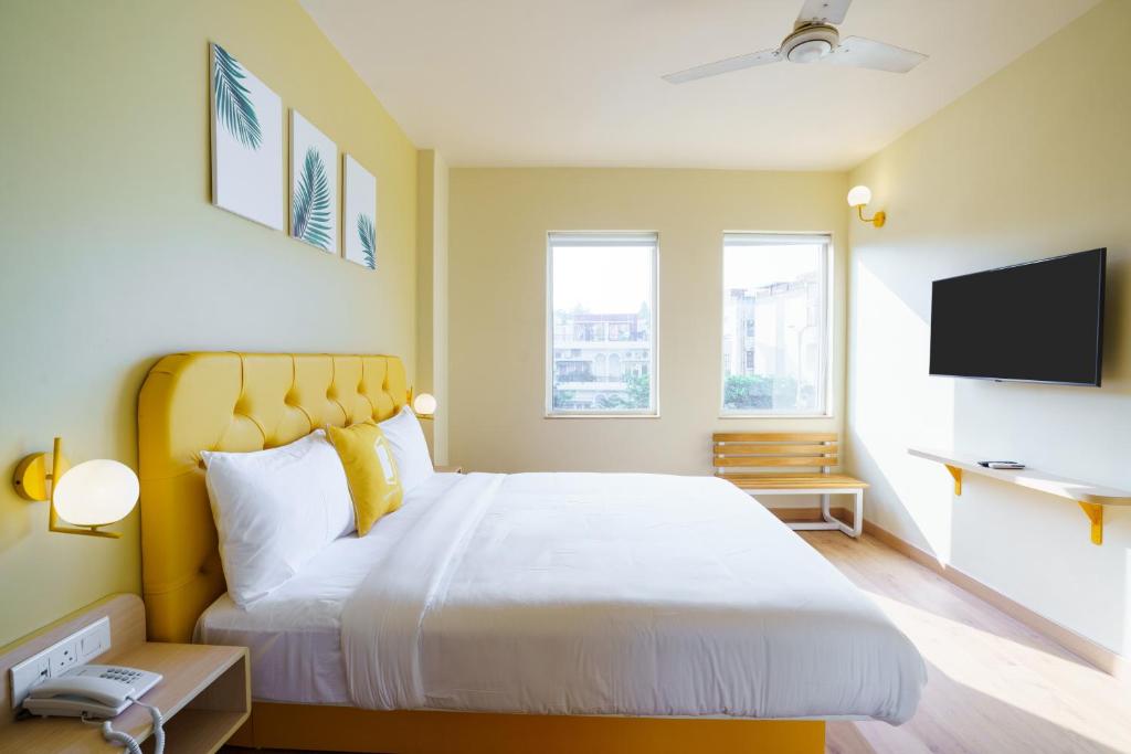 Postel nebo postele na pokoji v ubytování Bloom Hotel - GK2