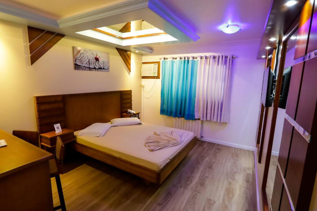 Postel nebo postele na pokoji v ubytování Motel Avenida (Adult Only)