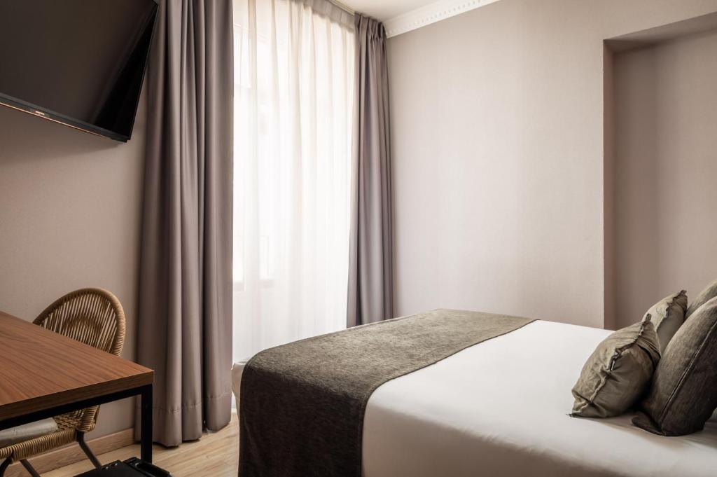 A bed or beds in a room at BYPILLOW The Citadel