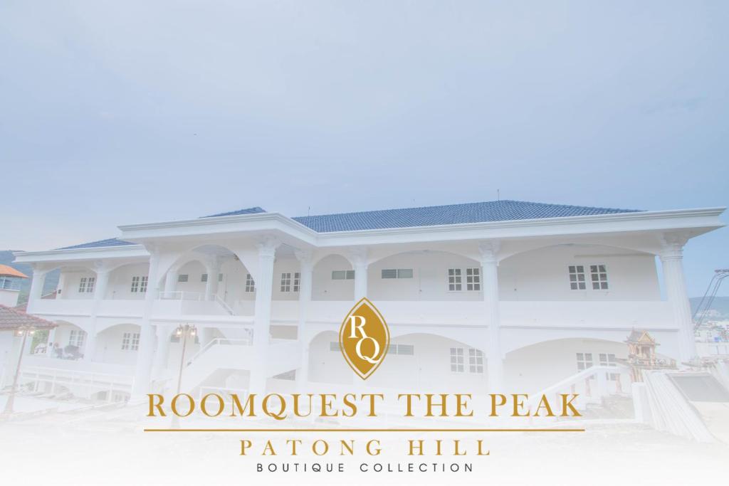a building with the wordsrooost the peak rating hill boutique collection at The Va Phuket Patong in Patong Beach