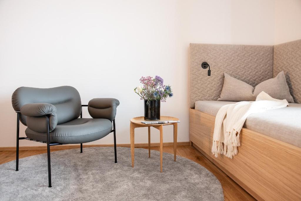 Postel nebo postele na pokoji v ubytování Hotel Nesslerhof