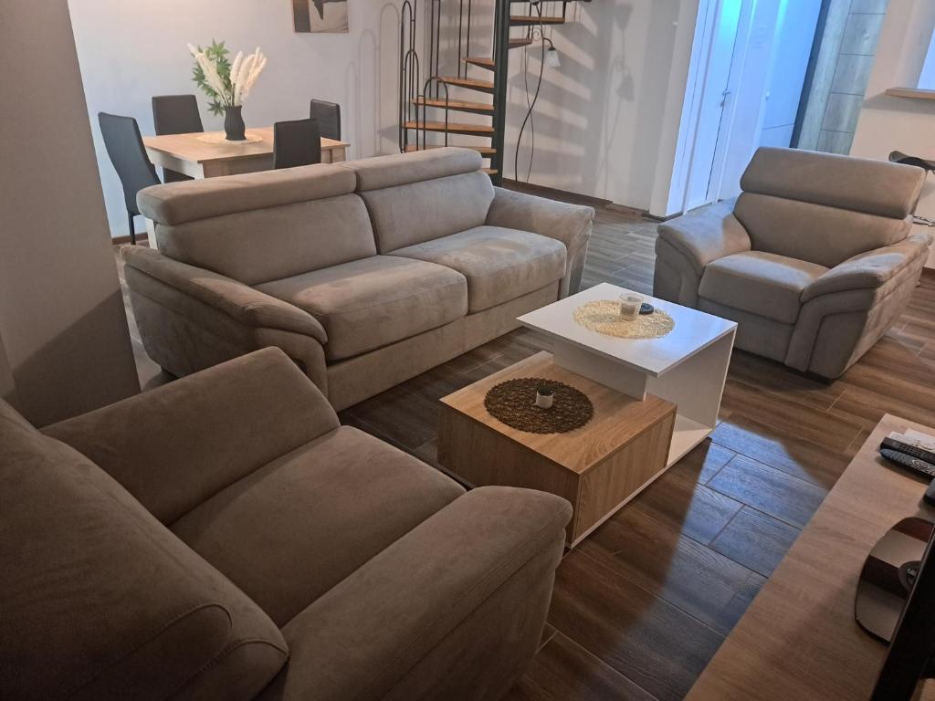 a living room with a couch and a table at Daka in Vrnjačka Banja