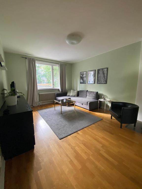 a living room with a couch and a table at STOCKHOLM APARTMENT & LIVING in Stockholm